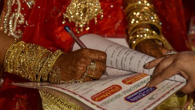 Vinod Prakash Khare (51), a resident of Rajnagar town in the district in Bundelkhand region, said he had married a Muslim woman nearly 28 years back. Post the marriage, his wife was assigned a Hindu name.(HT file for representation) Vinod Prakash Khare (51), a resident of Rajnagar town in the district in Bundelkhand region, said he had married a Muslim woman nearly 28 years back. Post the marriage, his wife was assigned a Hindu name.(HT file for representation)