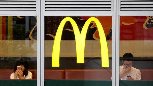 Customers using mobile phones are seen through the windows of a McDonald's store in Tokyo, Japan July 22, 2016. (Reuters File Photo) Customers using mobile phones are seen through the windows of a McDonald's store in Tokyo, Japan July 22, 2016. (Reuters File Photo)