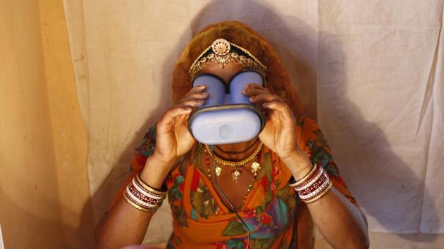 A woman goes through the process of eye scanning for Unique Identification (UID) database system at an enrolment centre at Merta district in Rajasthan February 21, 2013.(REUTERS)