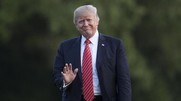 President Donald Trump waves as he walks from Maine One across the South Lawn of the White House in Washington, Wednesday, August 23. (AP Photo) President Donald Trump waves as he walks from Maine One across the South Lawn of the White House in Washington, Wednesday, August 23. (AP Photo)