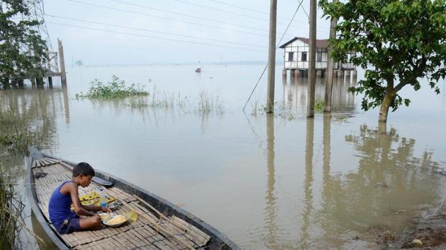 A child has his meal on a boat at a flood affected village in Morigaon district of Assam. Though the situation is said to be improving the Brahmaputra continues to flow above the danger mark at two places --Neematighat in Jorhat district and Dhubri. (PTI) A child has his meal on a boat at a flood affected village in Morigaon district of Assam. Though the situation is said to be improving the Brahmaputra continues to flow above the danger mark at two places --Neematighat in Jorhat district and Dhubri. (PTI)