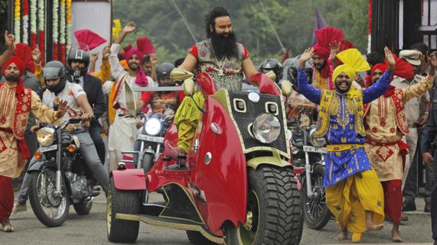 A file photo of controversial religious leader Gurmeet Ram Rahim Singh at a a press conference for his movie.(AP)