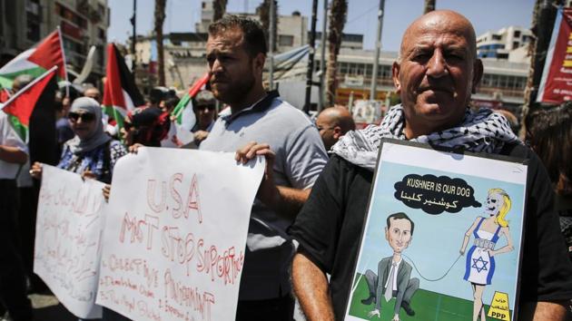 Palestinian demonstrators holding a cartoon depicting aenior White House advisor Jared Kushner along with other slogans protest in the West Bank city of Ramallah on August 24, 2017 against the arrival of a US delegation headed by Kushner to meet with Palestinian president Mahmoud Abbas. (AFP) Palestinian demonstrators holding a cartoon depicting aenior White House advisor Jared Kushner along with other slogans protest in the West Bank city of Ramallah on August 24, 2017 against the arrival of a US delegation headed by Kushner to meet with Palestinian president Mahmoud Abbas. (AFP)