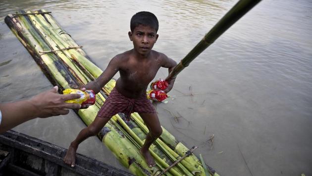 Successive waves of floods have wreaked havoc in the state of Assam, breaching the banks of the Brahmaputra inundating the low lying plains in the valley. Reeling with the aftermath, rickety boats and rafts often made from banana trunks held together by ropes are the only resort for those affected. From rescue and medical relief to even temporary schools, boats are the only means of getting by before floodwaters recede and normalcy is re-established. (Anupam Nath/AP) Successive waves of floods have wreaked havoc in the state of Assam, breaching the banks of the Brahmaputra inundating the low lying plains in the valley. Reeling with the aftermath, rickety boats and rafts often made from banana trunks held together by ropes are the only resort for those affected. From rescue and medical relief to even temporary schools, boats are the only means of getting by before floodwaters recede and normalcy is re-established. (Anupam Nath/AP)