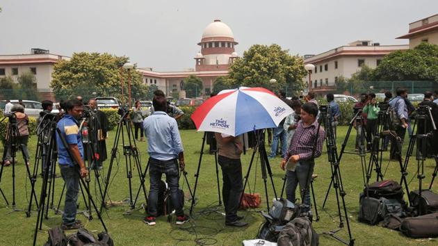 Television journalists are seen outside the premises of the Supreme Court in New Delhi, India August 22, 2017. REUTERS/Adnan Abidi (REUTERS)