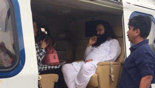 Gurmeet Ram Rahim Singh being taken in a chopper to Rohtak. The CBI court will announce the quantum of punishment for Singh on August 28. He faces up to seven years’ in jail.(HT Photo)