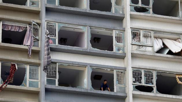 A man looks out from inside an apartment building through broken windows shattered by Typhoon Hato in Macau. The most powerful typhoon to hit the southern Chinese region in more than half a century bludgeoning into the city with winds of up to 200 kilometers per hour. (Tyrone Siu / REUTERS) A man looks out from inside an apartment building through broken windows shattered by Typhoon Hato in Macau. The most powerful typhoon to hit the southern Chinese region in more than half a century bludgeoning into the city with winds of up to 200 kilometers per hour. (Tyrone Siu / REUTERS)