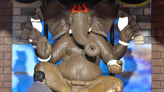 The must visit pandals include Lalbaugcha Raja which is believed to fulfill wishes and attracts millions of visitors. Goud Saraswat Brahmin (GSB) Seva Mandal at King’s Circle which is considered to be one of the richest mandals and known for their gold idols in the past and the Keshavji Naik Chawl pandal in Girgaum, one of the oldest pandals (125-years-old) where none other than Tilak had come as a visitor. (Anshuman Poyrekar/HT Photo) The must visit pandals include Lalbaugcha Raja which is believed to fulfill wishes and attracts millions of visitors. Goud Saraswat Brahmin (GSB) Seva Mandal at King’s Circle which is considered to be one of the richest mandals and known for their gold idols in the past and the Keshavji Naik Chawl pandal in Girgaum, one of the oldest pandals (125-years-old) where none other than Tilak had come as a visitor. (Anshuman Poyrekar/HT Photo)