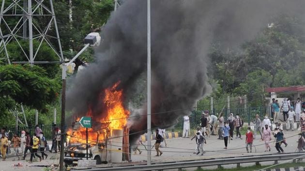 According to reports, at least 15 vehicles were set ablaze, six petrol pumps were burnt, eight power grids were damaged, 20 sewa kendras were ransacked and three telephone exchanges were set afire by dera followers in Punjab. (Keshav Singh/HT) According to reports, at least 15 vehicles were set ablaze, six petrol pumps were burnt, eight power grids were damaged, 20 sewa kendras were ransacked and three telephone exchanges were set afire by dera followers in Punjab. (Keshav Singh/HT)