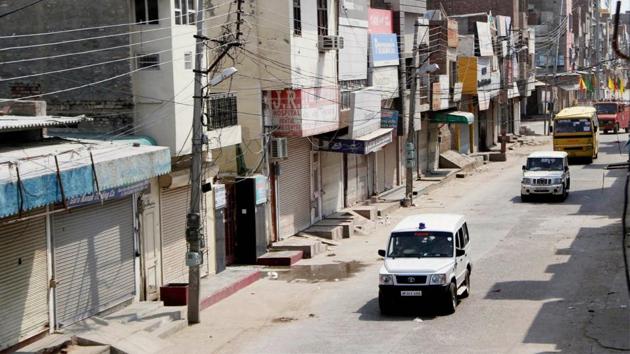 Vehicles of the police and paramilitary forces pass through streets of Sirsa, Haryana amid an indefinite curfew imposed ahead of a verdict expected in the case against Dera Sacha Sauda chief Gurmeet Ram Rahim Singh. With the lockdown in Haryana, the self-styled godman left Sirsa for Panchkula early Friday morning in a 200 car convoy. Now convicted, the quantum of sentence will be decided on Monday. (PTI)