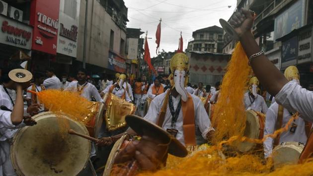 Dhol tasha pathaks during Ganpati procession in Pune. First observed during the Maratha empire set up by Chhatrapati Shivaji in the 16th century, the festival in its present form saw resurgence under Bal Gangadhar Tilak as a rallying ground for people beyond caste and class lines and a means of spreading ideas of nationalism and a sense of unity among the Indian population. (Pratham Gokhale/HT PHOTO) Dhol tasha pathaks during Ganpati procession in Pune. First observed during the Maratha empire set up by Chhatrapati Shivaji in the 16th century, the festival in its present form saw resurgence under Bal Gangadhar Tilak as a rallying ground for people beyond caste and class lines and a means of spreading ideas of nationalism and a sense of unity among the Indian population. (Pratham Gokhale/HT PHOTO)