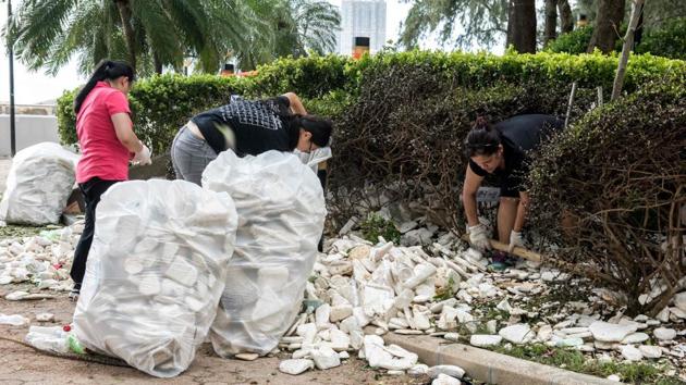 Residents and government workers pick up polystyrene and other rubbish in Heng Fa Chuen in Hong Kong. Macau’s leader Fernando Chui had requested the Chinese army’s involvement in ‘disaster relief’ after the highest category 10 Typhoon Hato pummelled the worlds biggest gambling hub. (Jayne Russell / AFP) Residents and government workers pick up polystyrene and other rubbish in Heng Fa Chuen in Hong Kong. Macau’s leader Fernando Chui had requested the Chinese army’s involvement in ‘disaster relief’ after the highest category 10 Typhoon Hato pummelled the worlds biggest gambling hub. (Jayne Russell / AFP)