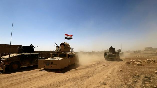 Military vehicles of the Counter Terrorism Service (CTS) are seen during the fight with the Islamic State militants in Tal Afar, Iraq, August 25, 2017. (REUTERS) Military vehicles of the Counter Terrorism Service (CTS) are seen during the fight with the Islamic State militants in Tal Afar, Iraq, August 25, 2017. (REUTERS)