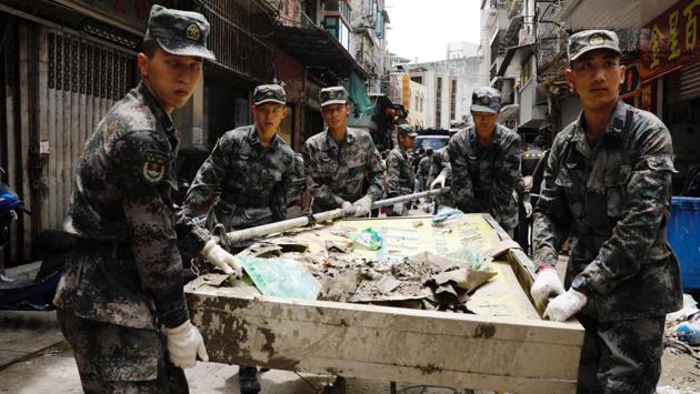 Chinese People’s Liberation Army troops were deployed onto the streets of Macau on Friday to help clean up in the aftermath of a devastating typhoon. Macau public broadcaster TDM reported some 1,000 Chinese PLA troops left their Macau barracks to assist in the recovery. Chinese troops are rarely seen on the streets of Macau. (Tyrone Siu / REUTERS) Chinese People’s Liberation Army troops were deployed onto the streets of Macau on Friday to help clean up in the aftermath of a devastating typhoon. Macau public broadcaster TDM reported some 1,000 Chinese PLA troops left their Macau barracks to assist in the recovery. Chinese troops are rarely seen on the streets of Macau. (Tyrone Siu / REUTERS)