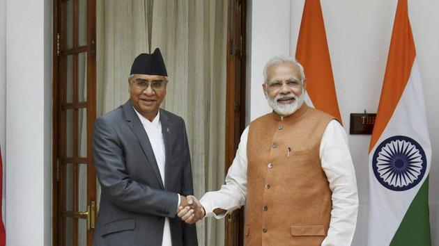 Prime Minister Narendra Modi (R) greets his Nepalese counterpart Sher Bahadur Deuba in New Delhi on Thursday. (PTI) Prime Minister Narendra Modi (R) greets his Nepalese counterpart Sher Bahadur Deuba in New Delhi on Thursday. (PTI)