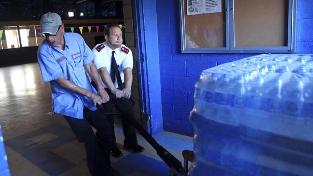 Buddy Cooper (L) and Patrick Gesner, commanding officer of the Salvation Army in Corpus Christi receive supplies of water and clean-up kits in preparation for Hurricane Harvey in Corpus Christi, Texas. Forecasters said storm surge along with rains and wind were likely as Hurricane Harvey was intensifying faster than previously forecast -- the likes of which haven’t been seen since 1999’s Hurricane Bret. (Rachel Denny Clow / Corpus Christi Caller-Times via AP)