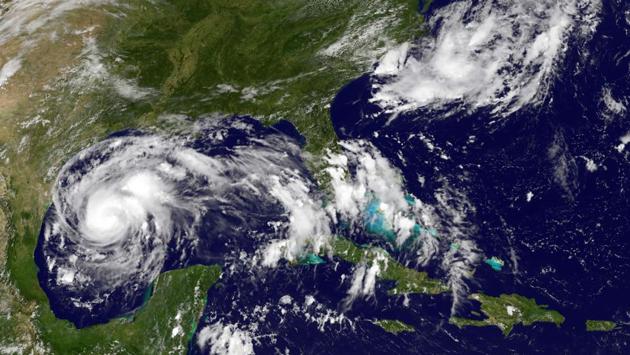 A satellite image taken on August 24, 2017 shows storm activity off the south east coast of the US. A major storm, Harvey is expected to target Texas and Louisiana taking aim at the heart of nation’s oil refining industry. The US National Hurricane Center (NHC) warns of a potential for ‘life threatening’ floods once the hurricane makes landfall. The NHC said Harvey could hit as a powerful Category 3, with winds of 209 kms per hour. (NOAA-NASA GOES Project / AFP)