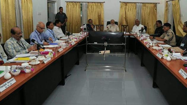 Prime Minister Narendra Modi holding a meeting with Bihar chief minister Nitish Kumar, deputy CM Sushil Kumar Modi and state government officers on the flood situation, at Purnia on Saturday. (HT photo) Prime Minister Narendra Modi holding a meeting with Bihar chief minister Nitish Kumar, deputy CM Sushil Kumar Modi and state government officers on the flood situation, at Purnia on Saturday. (HT photo)