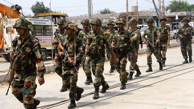 To avoid a repeat of the violence in Panchkula that left 34 people dead, 10 companies of paramilitary forces were deputed in Rohtak along with the army.(HT Photo)