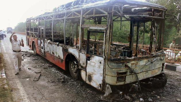 A DTC bus that was set on fire by followers of Dera Sacha Sauda chief Gurmeet Ram Rahim after he was conviction for rape, in New Delhi on August 25, 2017.(PTI Photo)