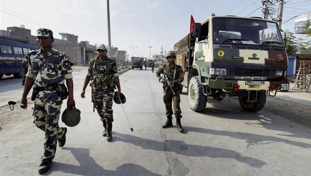 Army personnel take positions after deployment near Dera Sacha Sauda in Sirsa.(PTI Photo)