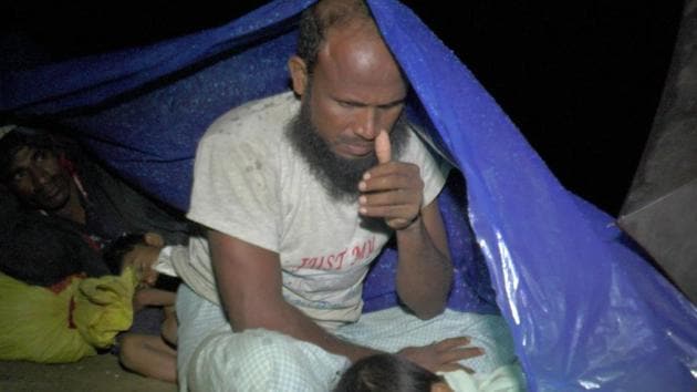 Displaced Rohingya people from Myanmar's northern Rakhine state shelter using tarps while gathered at the border town of Ukhiya, after Bangladeshi border guards stopped them from entering Bangladesh, on August 26. (AFP Photo) Displaced Rohingya people from Myanmar's northern Rakhine state shelter using tarps while gathered at the border town of Ukhiya, after Bangladeshi border guards stopped them from entering Bangladesh, on August 26. (AFP Photo)