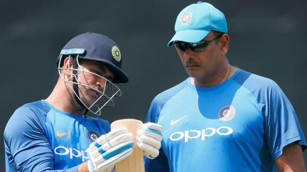 India's MS Dhoni shows his bat to team's coach Ravi Shastri ahead of their third One Day International match against Sri Lanka. (REUTERS) India's MS Dhoni shows his bat to team's coach Ravi Shastri ahead of their third One Day International match against Sri Lanka. (REUTERS)
