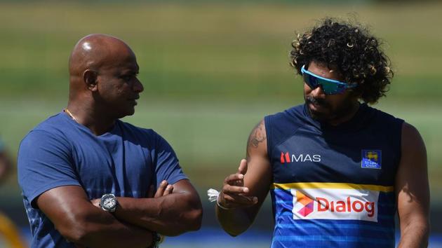 Lasith Malinga (L) speaks with chairman of selectors Sanath Jayasuriya during a practice session as the hosts aim to stay alive. (AFP) 