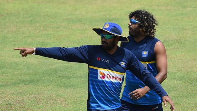 Chamara Kapugedera (L), who will captain Sri Lanka for the third ODI and Lasith Malinga (R) take part in a practice session. (AFP) 