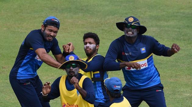 Angelo Mathews plays football with teammates at a practice session at the Pallekele International Cricket Stadium. The third ODI will take place on Sunday. (AFP) 