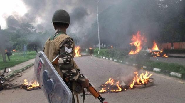A security personnel at the scene of violence following Dera Sacha Sauda chief Gurmeet Ram Rahim’s conviction in Panchkula on Friday. (PTI file) A security personnel at the scene of violence following Dera Sacha Sauda chief Gurmeet Ram Rahim’s conviction in Panchkula on Friday. (PTI file)