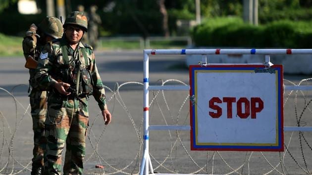 Soldiers stand guard at a checkpoint at Panchkula on August 26 after followers of controversial guru Ram Rahim Singh on August 25 went on a rampage after he was convicted of rape.(AFP)