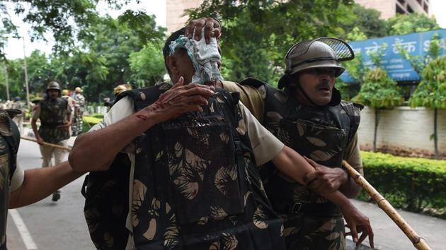 With scenes of violence emerging, injuries and casualties were reported among Dera supporters as well as security personnel during clashes. At least 30 have been killed so far while 250 are said to be injured. Most of the deaths were reported as a result of bullet injuries. (Money Sharma / AFP)