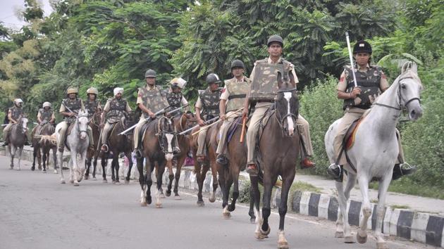 Reports of Dera supporters or ‘premis’ arriving to Panchkula in the thousands began emerging days in advance of the August 25 verdict. Police forces in Haryana and Punjab responded with flag marches to establish their presence as a precautionary measure. (Sant Arora / HT Photo)