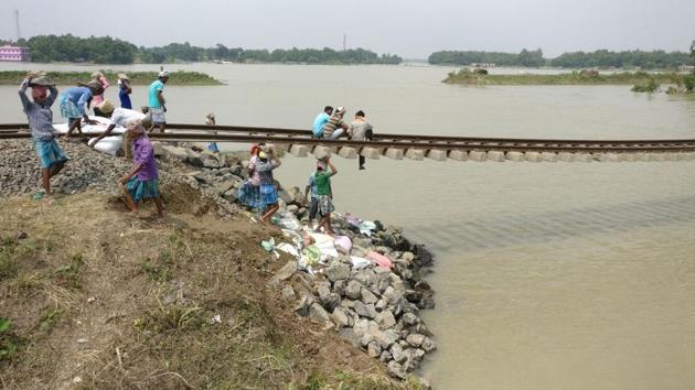 Bridge number 133 between Sudhani and Telta. Boulder dumping in progress at approach washed out by flood. (HT Photo) Bridge number 133 between Sudhani and Telta. Boulder dumping in progress at approach washed out by flood. (HT Photo)