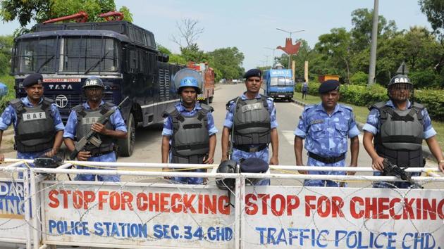 Security forces at the Chandigarh border after violence in Panchkula. (Keshav Singh/HT Photo) Security forces at the Chandigarh border after violence in Panchkula. (Keshav Singh/HT Photo)