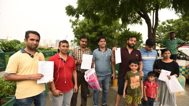 As many as 200 people received the possession letters on Saturday, with the disbursal process likely to continue in the coming days. (Virendra Singh Gosain/HT PHOTO) As many as 200 people received the possession letters on Saturday, with the disbursal process likely to continue in the coming days. (Virendra Singh Gosain/HT PHOTO)
