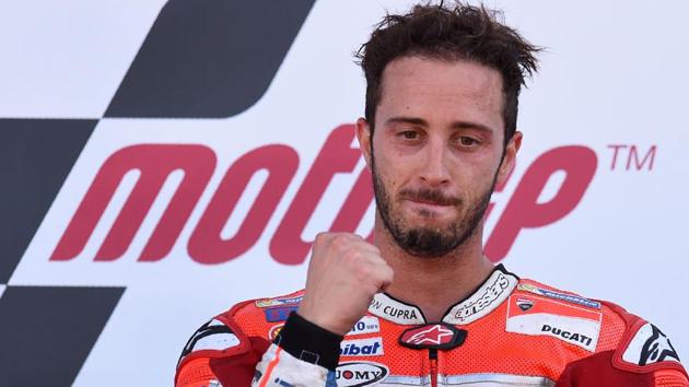 Ducati Team's Italian rider Andrea Dovizioso celebrates first place on the rostrum after the MotoGP race of the British Grand Prix. (AFP) Ducati Team's Italian rider Andrea Dovizioso celebrates first place on the rostrum after the MotoGP race of the British Grand Prix. (AFP)