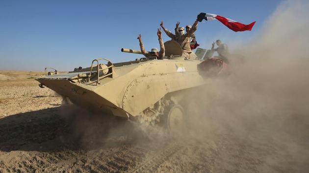 Iraqi forces backed by the Hashed Al-Shaabi advance towards the town of Tal Afar, west of Mosul, after the Iraqi government announced the beginning of the operation to retake it from the control of the Islamic State (IS) group on August 22, 2017. From Iraq conflict to the Great American eclipse, photos of the week from around the globe. (Ahmad Al Rubaye/ AFP) Iraqi forces backed by the Hashed Al-Shaabi advance towards the town of Tal Afar, west of Mosul, after the Iraqi government announced the beginning of the operation to retake it from the control of the Islamic State (IS) group on August 22, 2017. From Iraq conflict to the Great American eclipse, photos of the week from around the globe. (Ahmad Al Rubaye/ AFP)