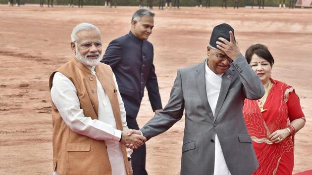 Prime Minister Narendra Modi shake hands with Nepalese Prime Minister Sher Bahadur Deuba while his wife Dr. Arzu Rana Deuba looks on during his ceremonial reception at Rashtrapati Bhavan in New Delhi  on Thursday. (Ajay Aggarwal/HT PHOTO) 
