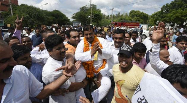 Ram Chandra, AAP candidate who won Bawana assembly bypoll, celebrates with supporters in New Delhi on Monday.(Sonu Mehta / HTPhoto)