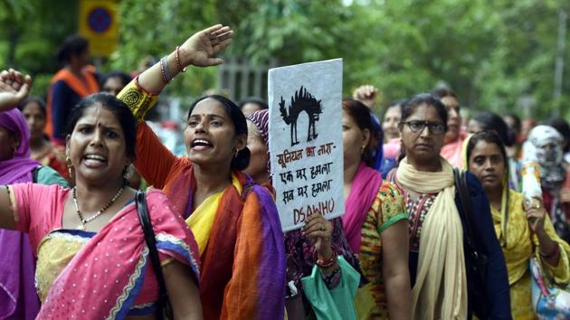 Anganwadi workers participate in a protest march in New Delhi, July 24. Anganwadi workers are responsible for providing a number of vital services including pre-school education, supplementary nutrition, nutrition counselling and growth monitoring(Sonu Mehta/HT PHOTO)