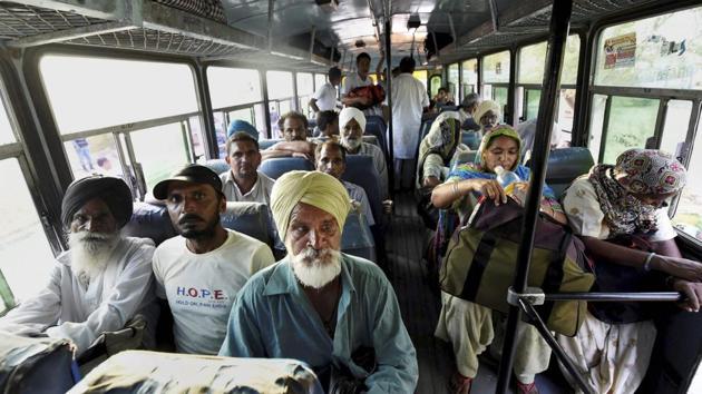 Gurmeet Ram Rahim Singh's followers board Haryana Roadways busses as they head back to their homes leaving Dera Sacha Sauda headquarters in Sirsa on Sunday. Security checks are being conducted in Haryana’s Panchkula, where 32 deaths were reported after the violence and six in Sirsa, the sect’s headquarters. (Vijay Verma / PTI)