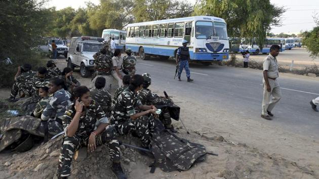 CRPF personnel on standby in Sirsa on Sunday. As many as 23 companies of paramilitary forces along with district police, range police and police forces from other areas have been deployed in Rohtak, apart from adequate number of women police personnel according to Haryana director general of police (DGP) BS Sandhu. (Vijay Verma / PTI)