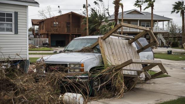 A trailer home's stairs are lodged in an SUV's windshield in Port Aransas, Texas, on Sunday. Officials continued to keep the city on lockdown, preventing residents from entering the city after Hurricane Harvey hit the Texas, damaging buildings and leaving tens of thousands without power. (AP) A trailer home's stairs are lodged in an SUV's windshield in Port Aransas, Texas, on Sunday. Officials continued to keep the city on lockdown, preventing residents from entering the city after Hurricane Harvey hit the Texas, damaging buildings and leaving tens of thousands without power. (AP)