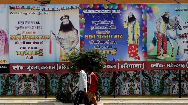 Signboards outside Ram Rahim Singh’s Dera Sacha Sauda ashram in Sirsa.(AFP)