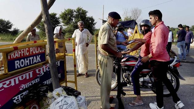 Security Personnel keep strict vigil near Sunaria Jail where Dera Sacha Sauda chief Ram Rahim’s quantum of punishment will be announced in Rohtak on Sunday. (PTI Photo) Security Personnel keep strict vigil near Sunaria Jail where Dera Sacha Sauda chief Ram Rahim’s quantum of punishment will be announced in Rohtak on Sunday. (PTI Photo)