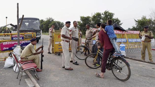 According to ANI, 23 dera followers have been arrested in Punjab’s Sangrur till now. High alert prevails in Meerut along the UP border, vigils across Haryana and Punjab and barricades back up in Panchkula. (Kamal Singh / PTI)