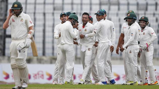 Shakib Al Hasan celebrates with his Bangladesh teammates after the dismissal of Australia's Nathan Lyon on Day 1 of the first Test in Dhaka on Sunday. (AP) Shakib Al Hasan celebrates with his Bangladesh teammates after the dismissal of Australia's Nathan Lyon on Day 1 of the first Test in Dhaka on Sunday. (AP)