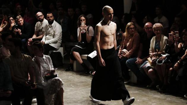 A model presents a creation during the Sao Paulo Fashion Week in Sao Paulo, Brazil on August 28, 2017. (AFP )